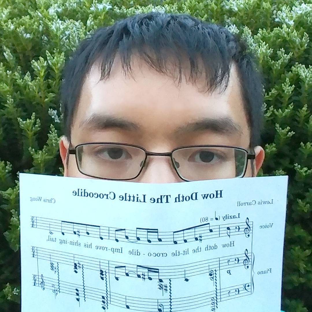 Chris holding up a composition he wrote